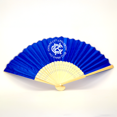 A blue and white silk hand fan with a KCC logo and 'No Other Club' printed on the front.
